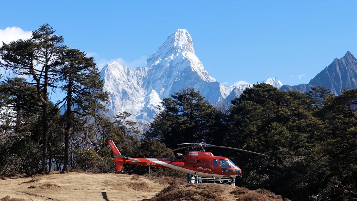 Helicopter and Mt. Ama Dablam